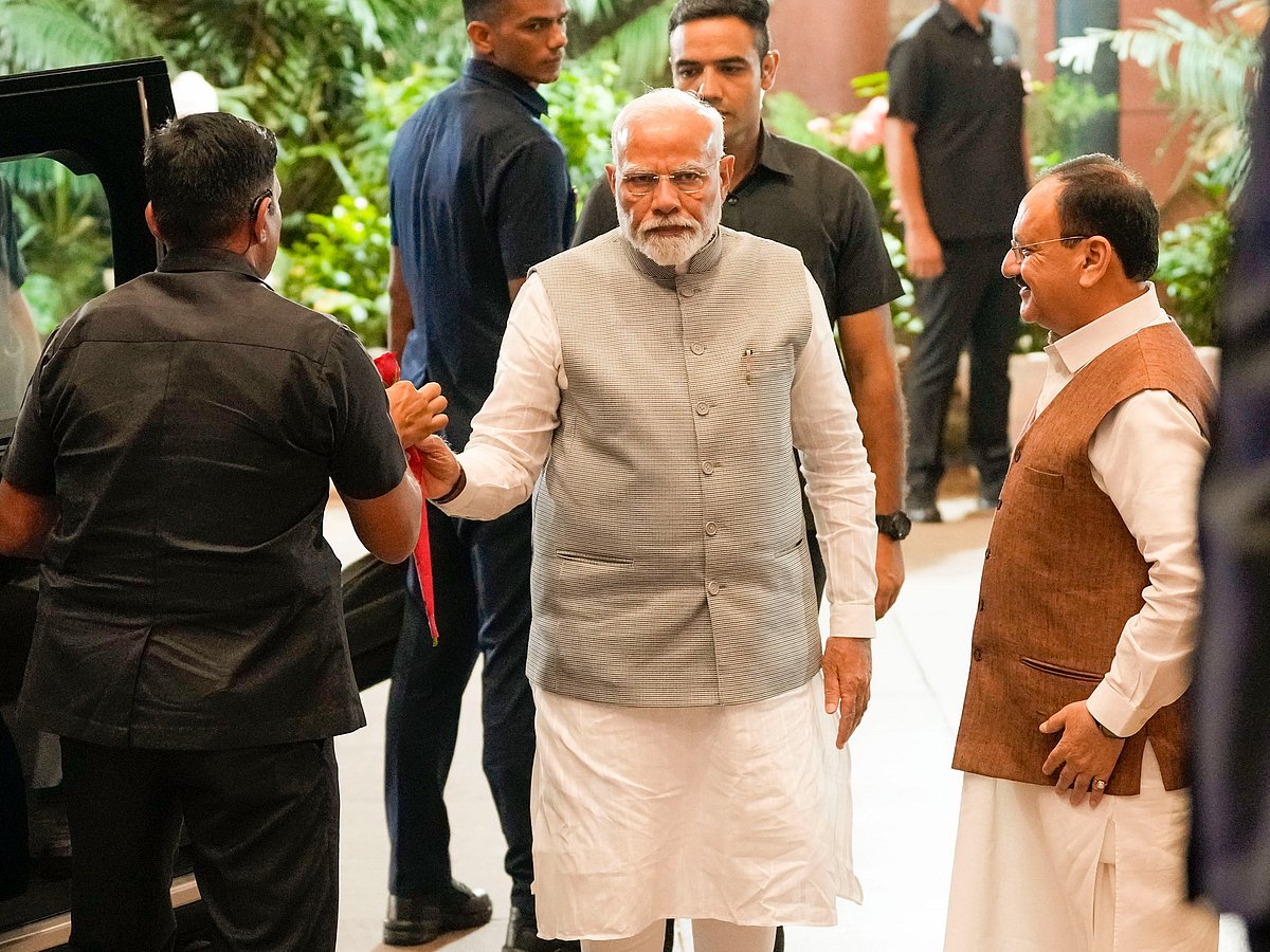 Prime Minister Narendra Modi being greeted by BJP National President JP Nadda as he arrives for the BJP Central Election Committee meeting ahead of J&K and Haryana assembly polls, at BJP HQ in New Delhi - PTI